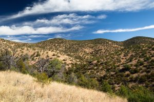 Desert Hills Below Midday Clouds
