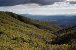 Stormy Cloud over Oak-Lined Mountains