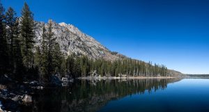 The Teton Mountains rising high above Jenny Lake near the mouth of Cascade Canyon. Grand Teton National Park, Wyoming