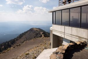 The Mount Washburn fire lookout tower rising high above the surrounding landscape. Yellowstone National Park, Wyoming