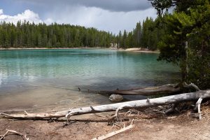 Rain showers and storm clouds passing over Clear Lake. Yellowstone National Park, Wyoming