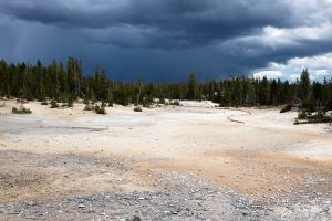 Heavy storm clouds building above a geyser basin along the Ribbon Lake Trail. Yellowstone National Park, Wyoming