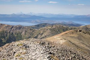 The Avalanche Peak Trail winding through alpine terrain as Absaroka Mountain peaks rise in the distance. Yellowstone National Park, Wyoming