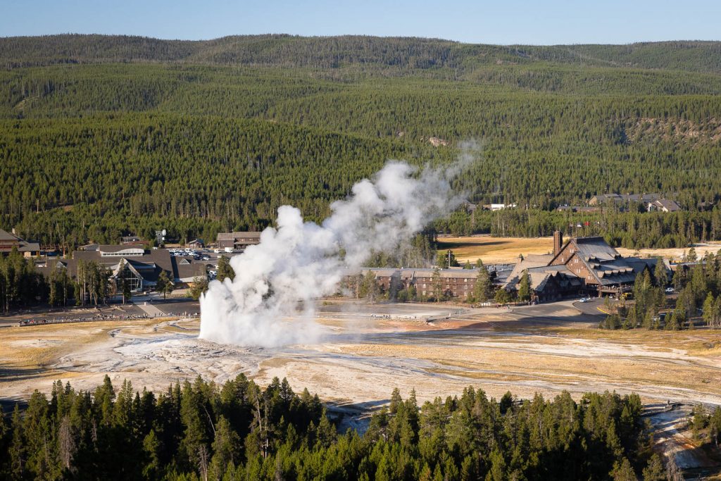 Old Faithful Erupting Below Observation Point